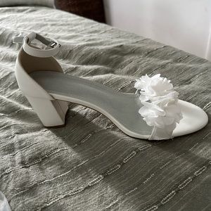 Brand new white pumps. Bought for wedding festivities and never wore. Size 43